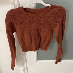 Rust colored Fabletics workout top